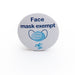 Light blue pin badge featuring dark blue lettered message 'Face mask exempt' and colourful face covering icon on white background