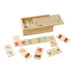 Birds eye photo of the illustrated wooden dominoes laid out flat, in front of the wooden box which they are stored in. The colourful illustrations on the dominoes and wooden box include ladybirds, strawberries, hedgehogs and bumblebees.