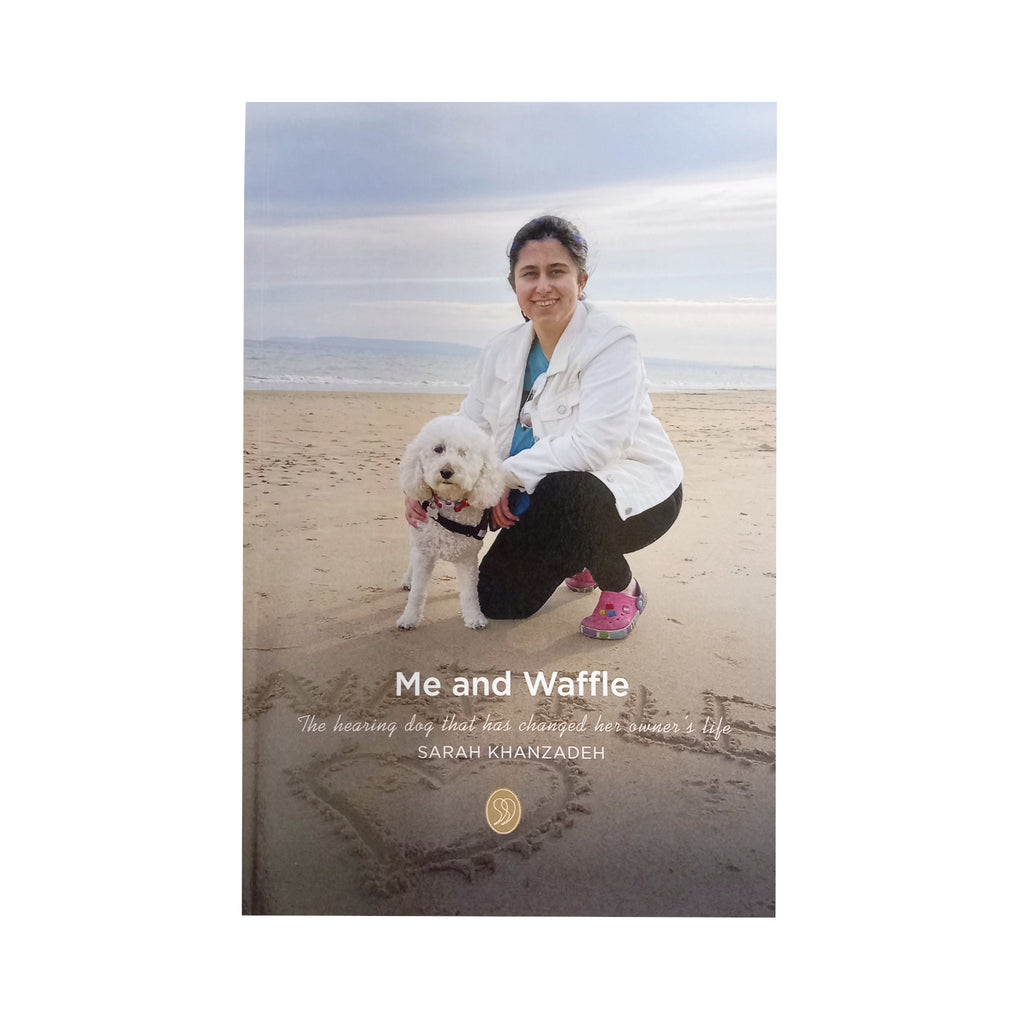 A beautifully written book about Sarah and her Hearing Dog Waffle a white cockapoo. The book charts Sarah's early years, her hearing loss, her surgery, adjusting to school life and meeting her Hearing Dog Waffle who made such a difference to her life. Image shows front cover of 90 page paperbook , with Sarah crouching down on a sandy beach with her Hearing Dog Waffle the cockapoo.