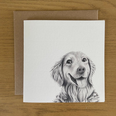 Card with a hand drawn pencil design of a golden retriever with a brown kraft envelope