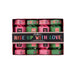 A beautifully presented pink and red box with colourful writing saying 'Rise Up With Love', written on a black paper band across the box.  Box displays four individual 30ml handcreams. Packed in four individual crackers (two pink and two green) which can be split into four lovely table gifts