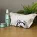 Dog‑illustrated cotton toiletry bag with lined interior and zip, handmade by a UK small business.