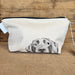 Dog‑illustrated cotton toiletry bag with lined interior and zip, handmade by a UK small business.