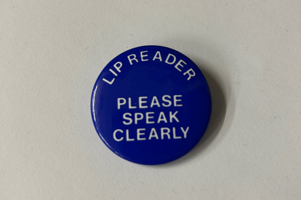 Lipreader pin badge