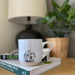 Stoneware mug with a detailed Cooper Cockapoo illustration, weighty feel and matt finish, designed and hand‑finished in the UK.
