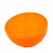 Orange plastic dog toy, in the shape of a segmented orange on a white background