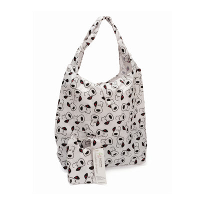 Foldway shopping bag with a cartoon puppy face logo pattern. The bag is unfolded and stood up behind the small pouch that it packs down into. 