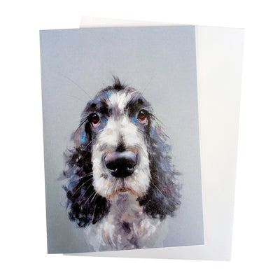  Light blue colourway portrait greeting card, with a grey / blue envelope.  The head of a beautifully illustrated blue rhone cocker spaniel is situated in centre of card.  The card has been created by artist Nicky Litchfield. Hearing Dog logo is printed on the back of the card as proceeds from the sale of this card will go to Hearing Dogs for Deaf People.