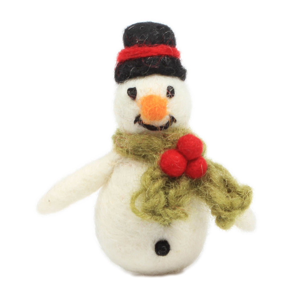 A fuzzy, felt figure of a smiling snowman wearing a black hat and green scarf with red pom poms, resembling holly.