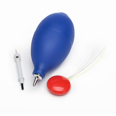 Selection of hearing aid care tools including white multi-tool, blue earmould puffer and multi-wired vent cleaner with red button
