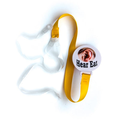 Yellow lanyard accessory with securing button and straps for hearing aids